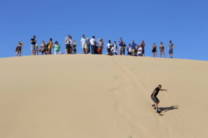 Nomadic people walking in the desert.